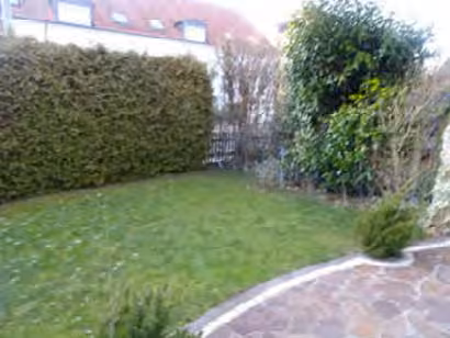 Zwangsversteigerung Doppelhaushälfte in Neufahrn b. Freising – Terrasse auf der Westseite mit dem angebauten Freisitz.