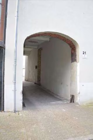 Zwangsversteigerung Mehrfamilienhaus in Gelsenkirchen, Heßler – Durchfahrt von der Heßlerstraße in den Hofbereich.