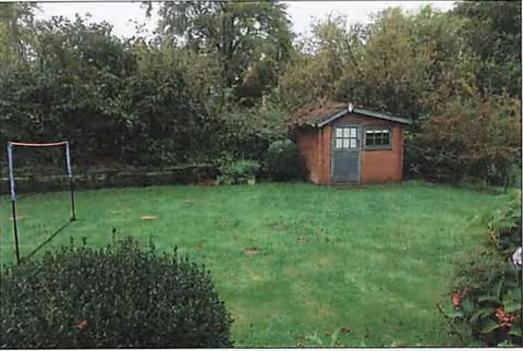 Zwangsversteigerung in Nehms, Grönwohld – Südwestansicht mit überdachter Terrasse und Gartengrundstück.