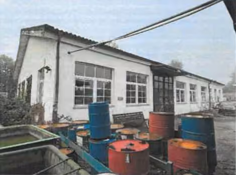 Zwangsversteigerung Gewerbe in Meckesheim – Westansicht des Produktions- und Werkstattgebäudes (Gebäude 1) auf Flurstück 4811/9.