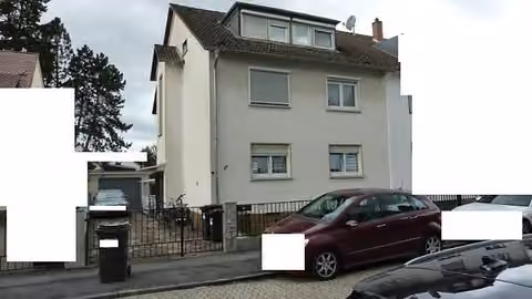 Zwangsversteigerung Mehrfamilienhaus in Darmstadt, Arheilgen – Frontale Straßenansicht des Gebäudes.