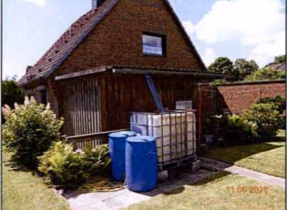 Zwangsversteigerung Einfamilienhaus in Brunsbüttel – Südostfassade des Wohnhauses mit Terrassenbereich